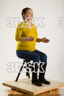 Sitting reference of yellow sweater blue jeans Gwendolyn 0014